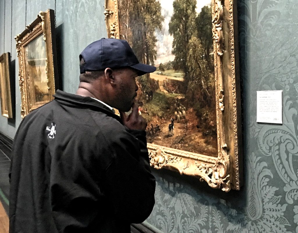 Poloafrica player studying the Constable at the National Gallery, London