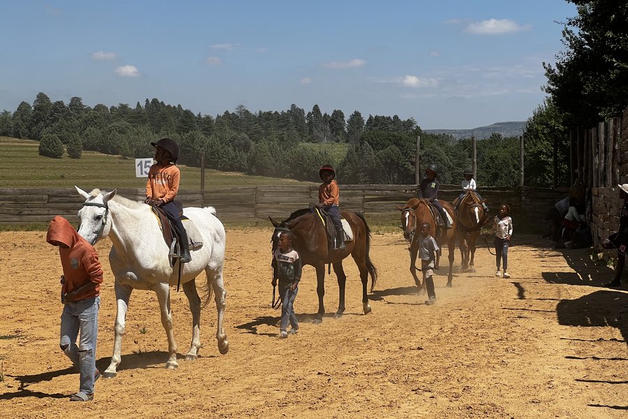 Scholars riding in the arena